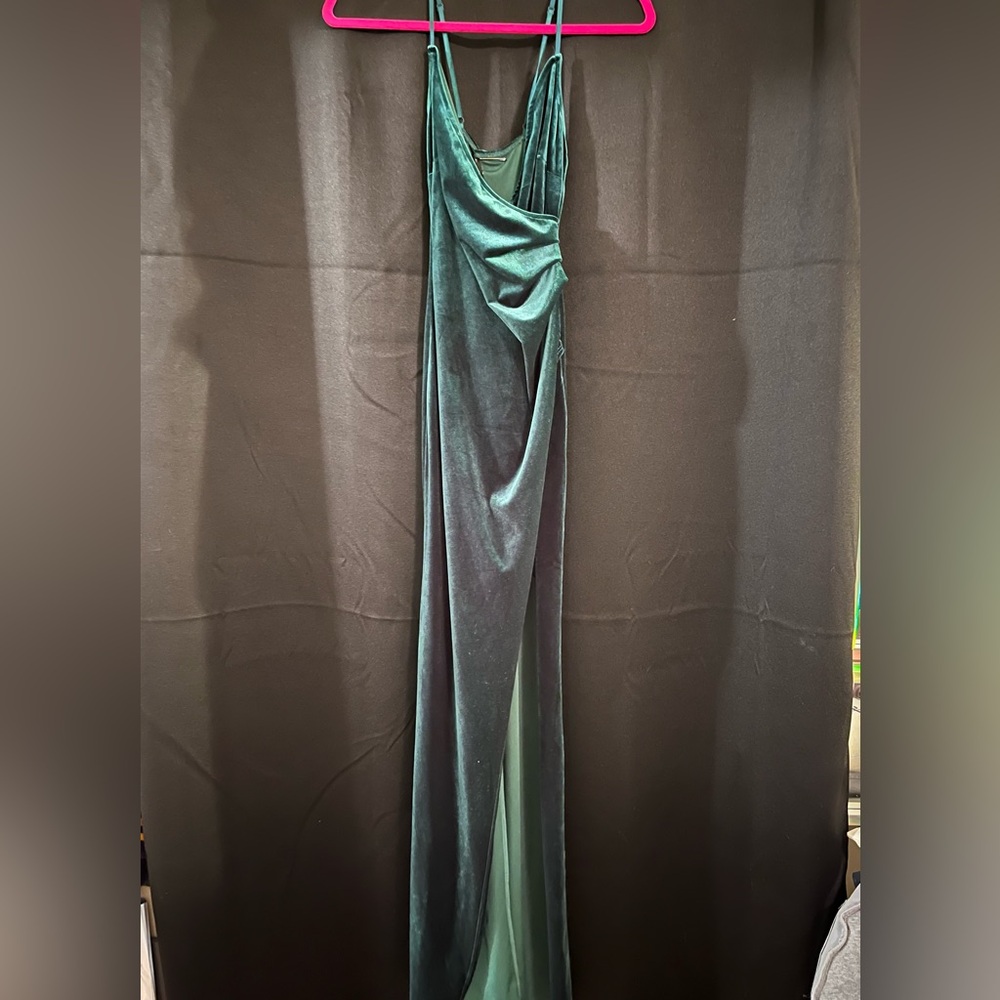 Velvet emerald green high slit dress.